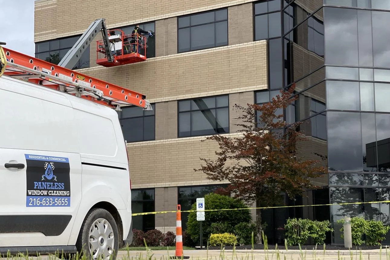 Man on a lift cleaning windows westlake oh paneless experience window cleaning Man on a lift cleaning windows westlake oh paneless experience window cleaning